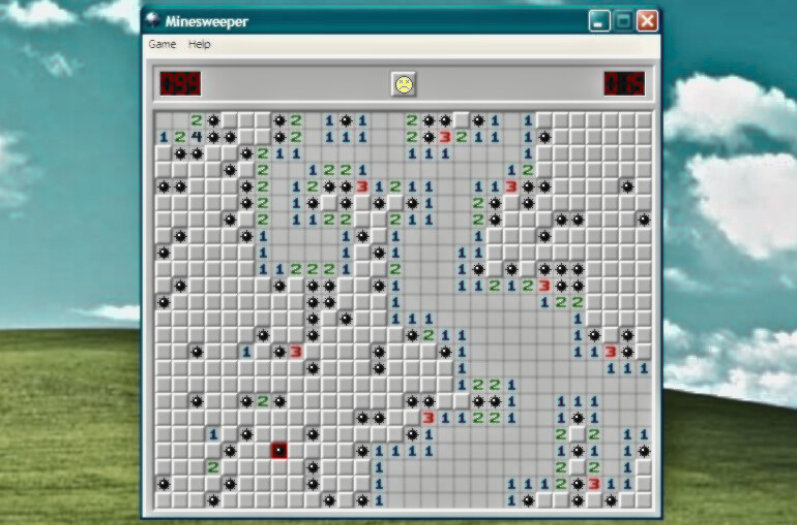 The background resembles an old school Windows desktop background with rolling hills and a blue sky with clouds. A window is open and showing the game Minesweeper has just been lost.